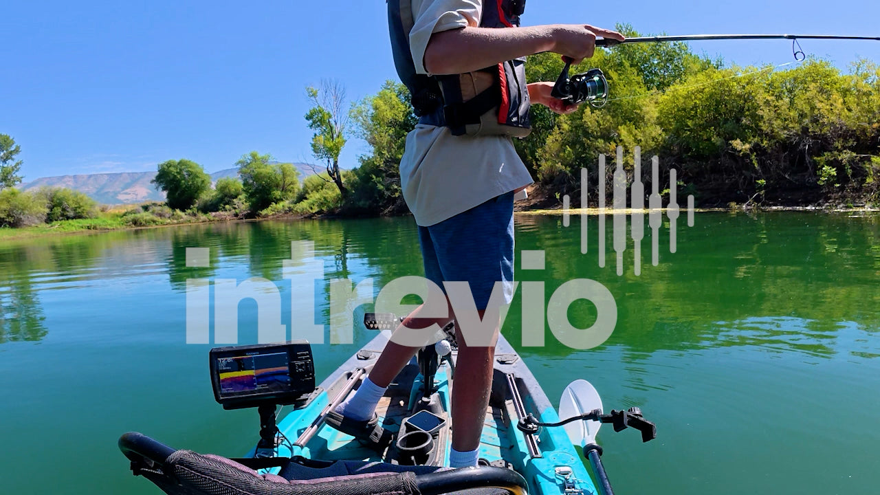 Catching Smallmouth Bass Standing in Kayak OTS-2