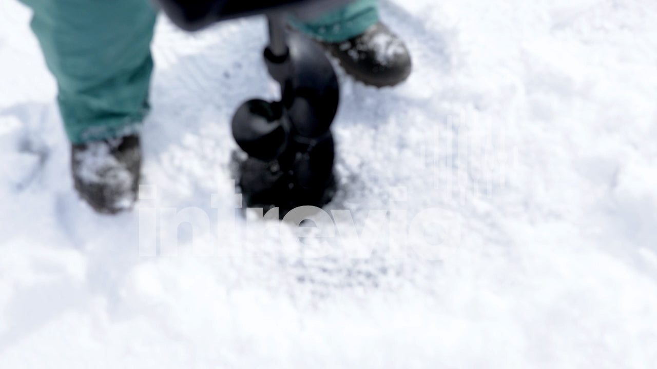 Cutting Fishing Hole in Ice With Gas Powered Ice Auger-02