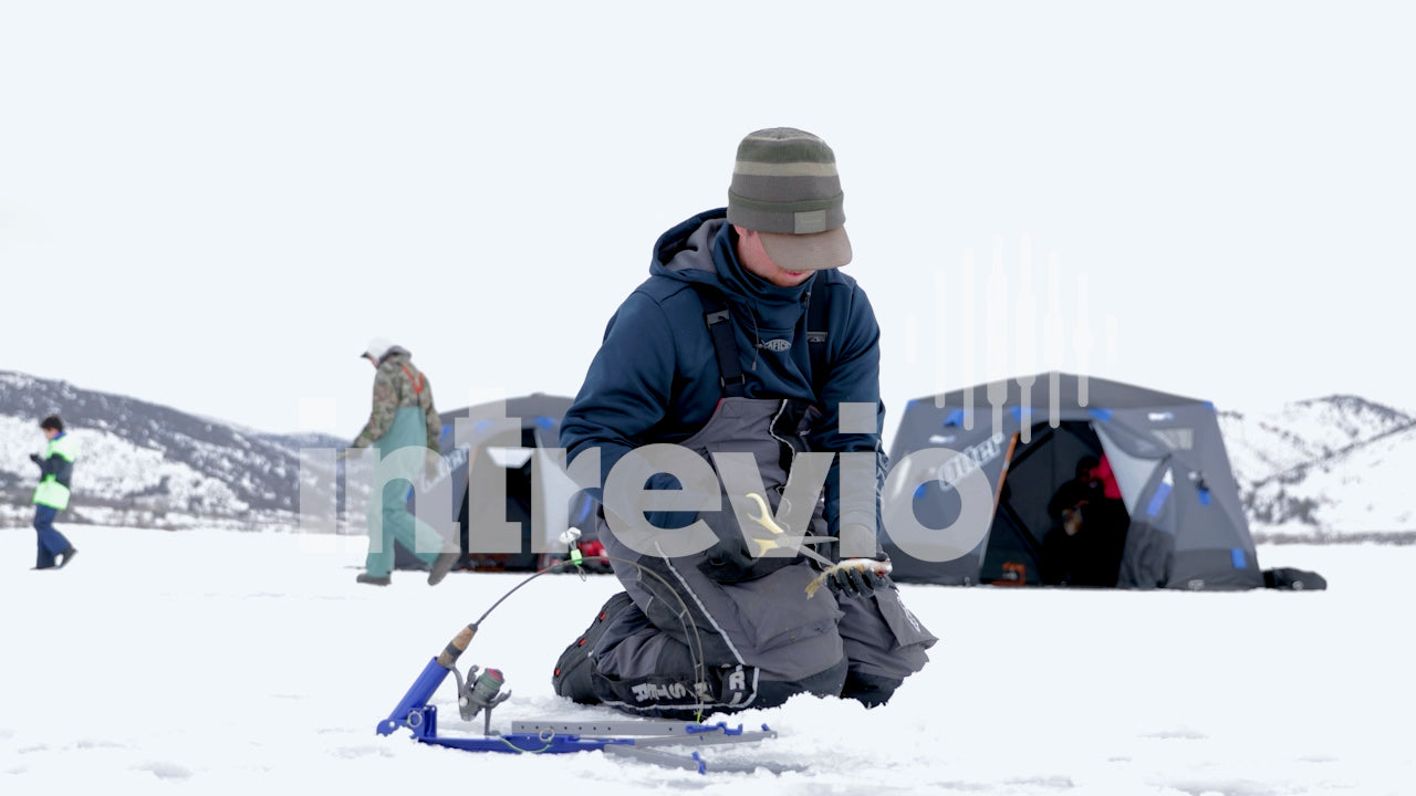 Ice Fishing Camp Cutting Fish as Bait