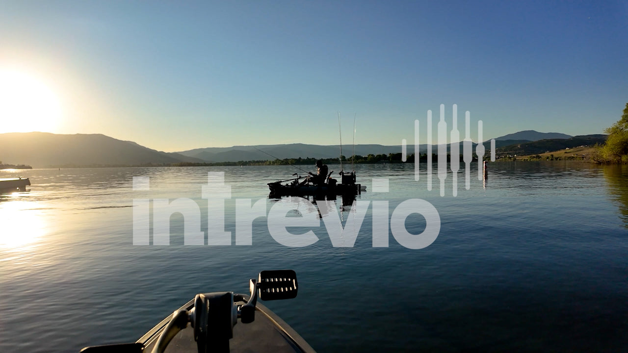 Silhouette in Kayak on Lake