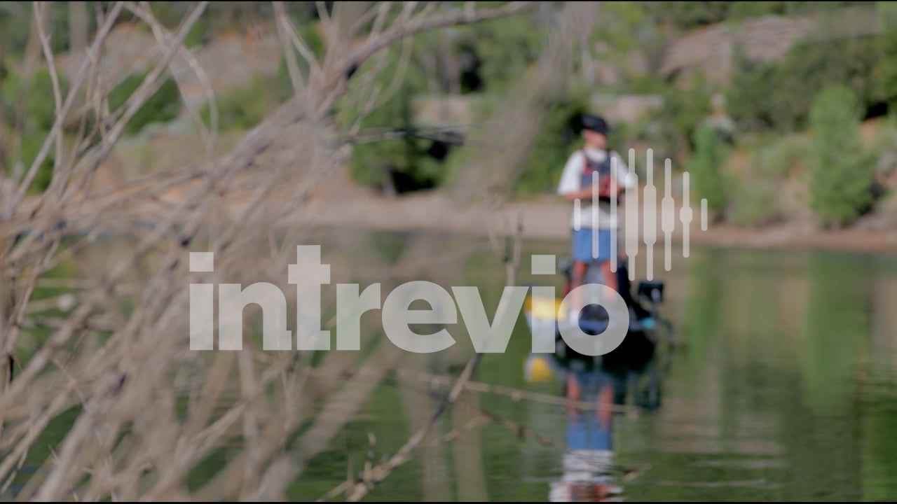 Standing and Fishing in Kayak Rack Focus to Bush