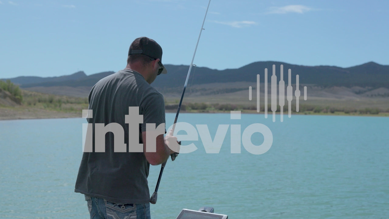 Reeling in Smallmouth Bass Jumping out of Water