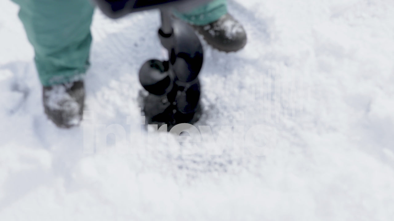 Cutting Fishing Hole in Ice With Gas Powered Ice Auger-02