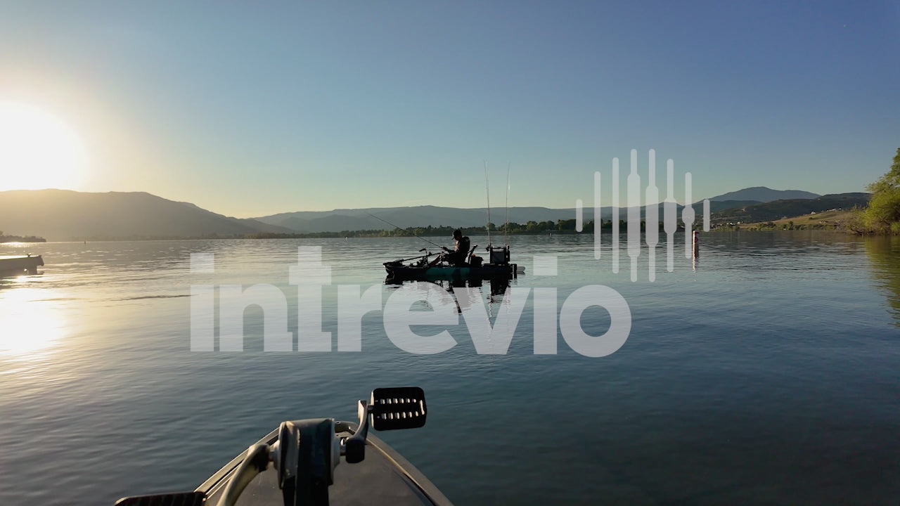 Silhouette in Kayak on Lake